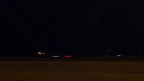 POV side view driving in car traffic on a very dark night on city streets Video stock 162012018