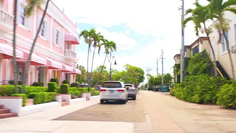 Pov side view driving Florida Naples shopping area with stores resturants Stock Footage 218325828
