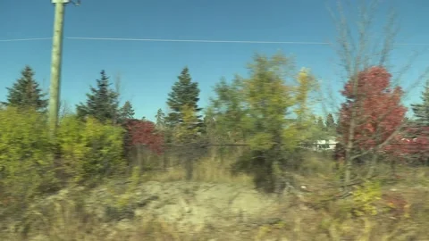 POV side view driving shot from a train window in suburbs and city Video stock 219869267