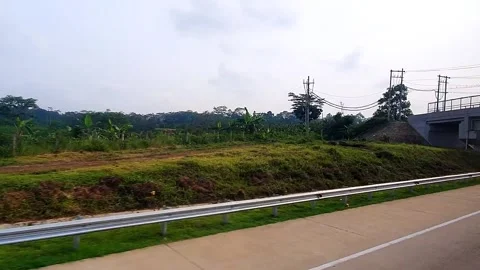 POV of sightseeing a landscape through the window from inside a moving bus .. 스톡 동영상 295138244