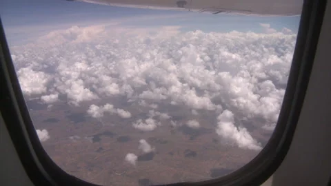 POV of the sky from the inside of an aeroplane Stock Footage 310540220