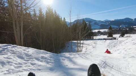 POV sledding down the hill in slow motion in winter day, Zakopane. Stock Footage 152451807