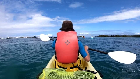 POV Slow Motion of Tourists Paddling In Kayak In The Galapagos Islands Stock Footage 116346053