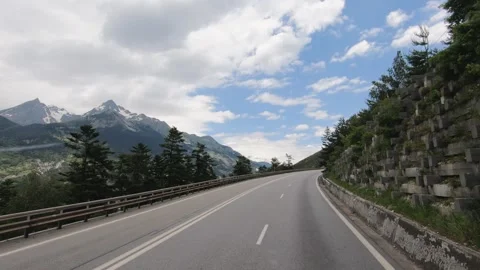 POV slow movement forward along the road of a picturesque mountain serpentine in Stock Footage 283683060