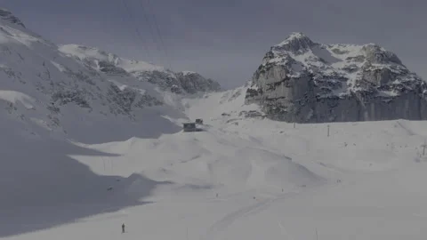 POV smooth skiing down a powder covered slope in the Alps Stock Footage 218405323