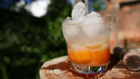 POV of someone adding cachaça to a caipirinha glass. A Caipirinha recipe Stock Footage 276586190