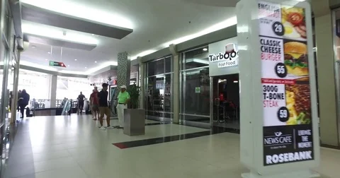 Pov stabilized Interior corridor shot of Rosebank Mall Stock Footage 72398344