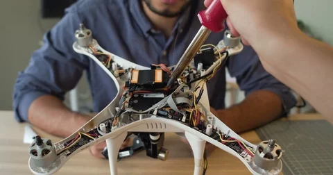 P.O.V. Startup Partners Experimenting Building A Drone Stock Footage 80319748