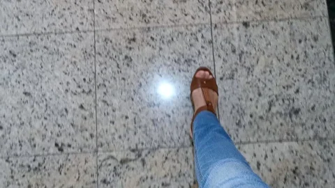 POV. Steel elevator door opens. Feet with brown sandals, classic blue jeans. Stock Footage 125198835