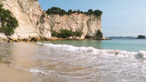 POV: Strolling down stingray bay's beach staring at the waves. Coromandel. Stock Footage 104588725