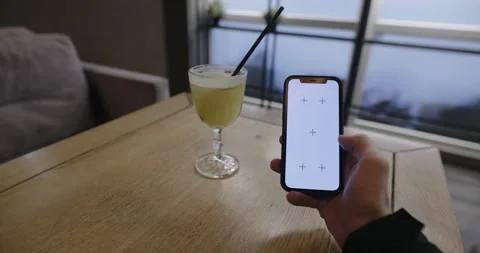 POV of swipe left and right smartphone with empty screen at a restaurant table Stock Footage 331598159
