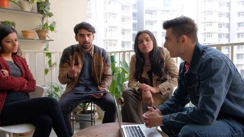 POV of a team member, off camera,  discussing in an informal discussion in a spi Stock Footage 101178913