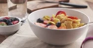 Pov Teen Girl Eating Healthy Breakfast Cornflakes With Berries Poured With Milk Stock Footage