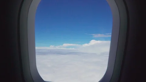  Pov through airplane window into beautiful sunny landscape of clouds Stock Footage 109504479