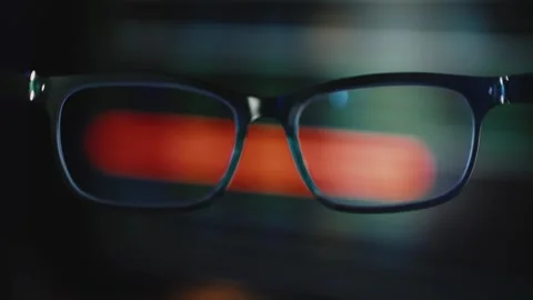 POV Through Eyeglasses of Programmer Coding in a Dark Computer Workspace Stock Footage 342353206