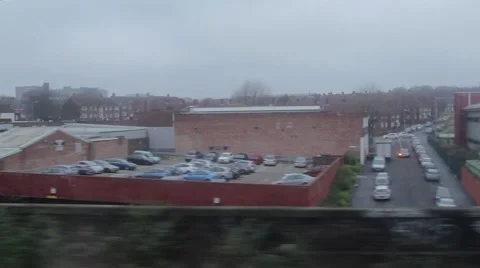 POV through Window Train Travels Past Urban Scene Video stock 44520209