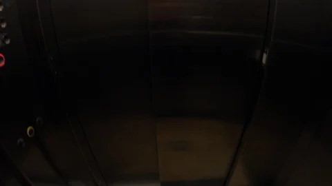POV. Tilt in the cabin elevator. Feet in sandals leave the elevator. Stock Footage 126657787