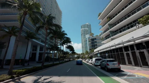POV Time-lapse drive through a modern coastal city with tall buildings Video stock 326873671