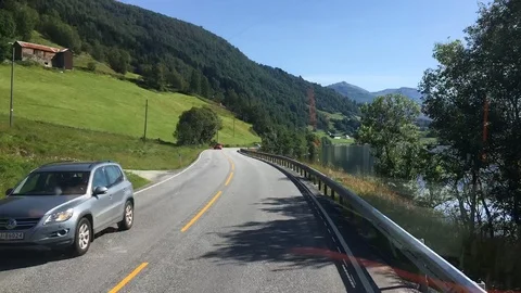 POV Time Lapse View of Mountain, Valley, and Fjord Landscape in Norway Stock Footage 115957173