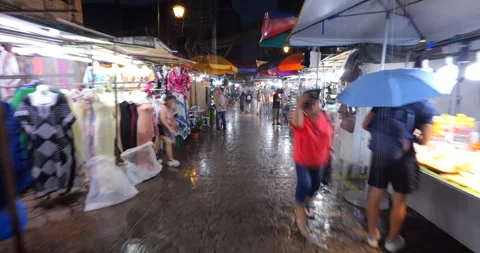 POV time lapse of walk through Petaling market at rainy night Stock Footage 319637398