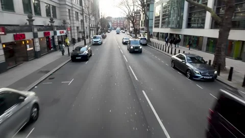 POV from the top deck of a bus driving along Horseferry Road in London England Vídeos de archivo 331784048