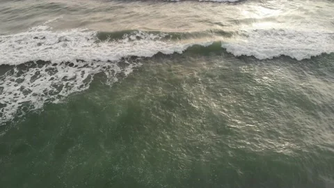 Pov tracking  formation of a large ocean wave with emerald water and white foam Stock Footage 142266663