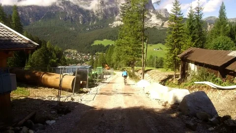 Pov, tractor cab, work in progress, and mountain bikers, Alta Badia Stock Footage 79642791