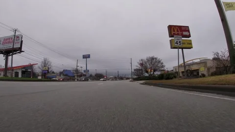POV traffic close to the ground view McDonalds IHop Waffle House and cars Stock Footage 148794726