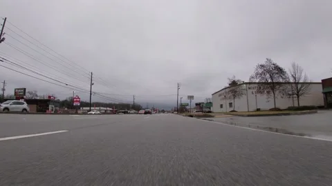 POV traffic close to the ground view Subway and Wendys Stock Footage 148796009