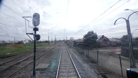 POV of a train advancing through rails in rural town 4K 60fps Stock Footage 192448927
