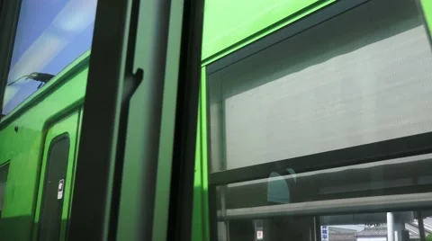 POV Train Car Window Passing By Green Commuter Train 4K Stock-Footage 44932767