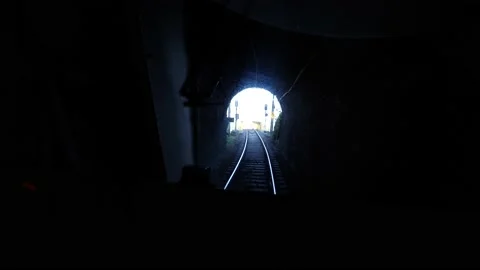 POV of train going through tunnel and exiting into bridge over river 4K Stock Footage 192451438