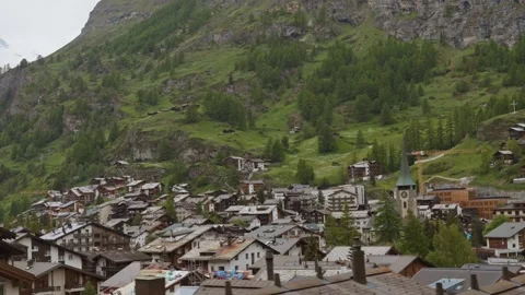 POV from a train passing through Zermatt mountain resort. Travel video Video stock 301549293