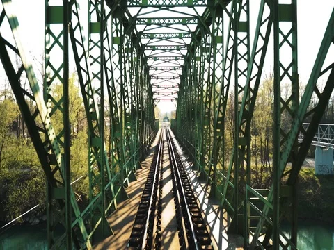 POV train riding over old green steel brige. Stock Footage 106811329