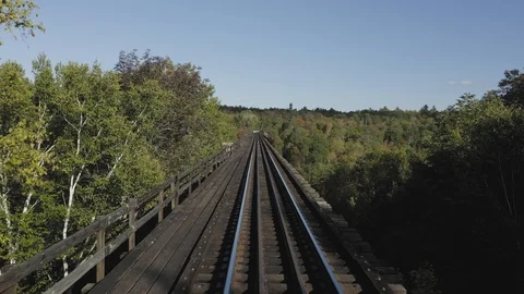 POV Train track view over Onawa Trestle Bridge 4K Stock Footage 117951152
