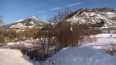 POV From Train Window Traveling Through Snowy Village In Winter. Stock Footage 328600721