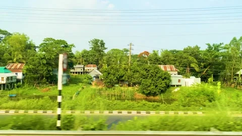 POV train window view of traditional Bangladesh hut houses in Dhaka Barisal Stock Footage 309001987