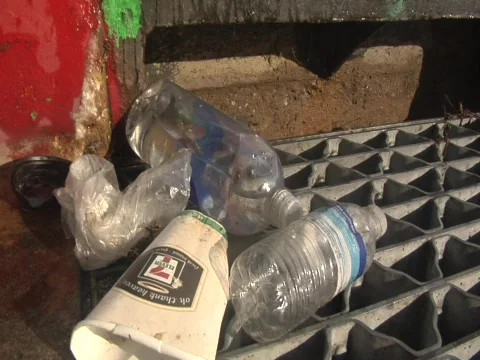 POV of trash on a storm drain Video stock 609900