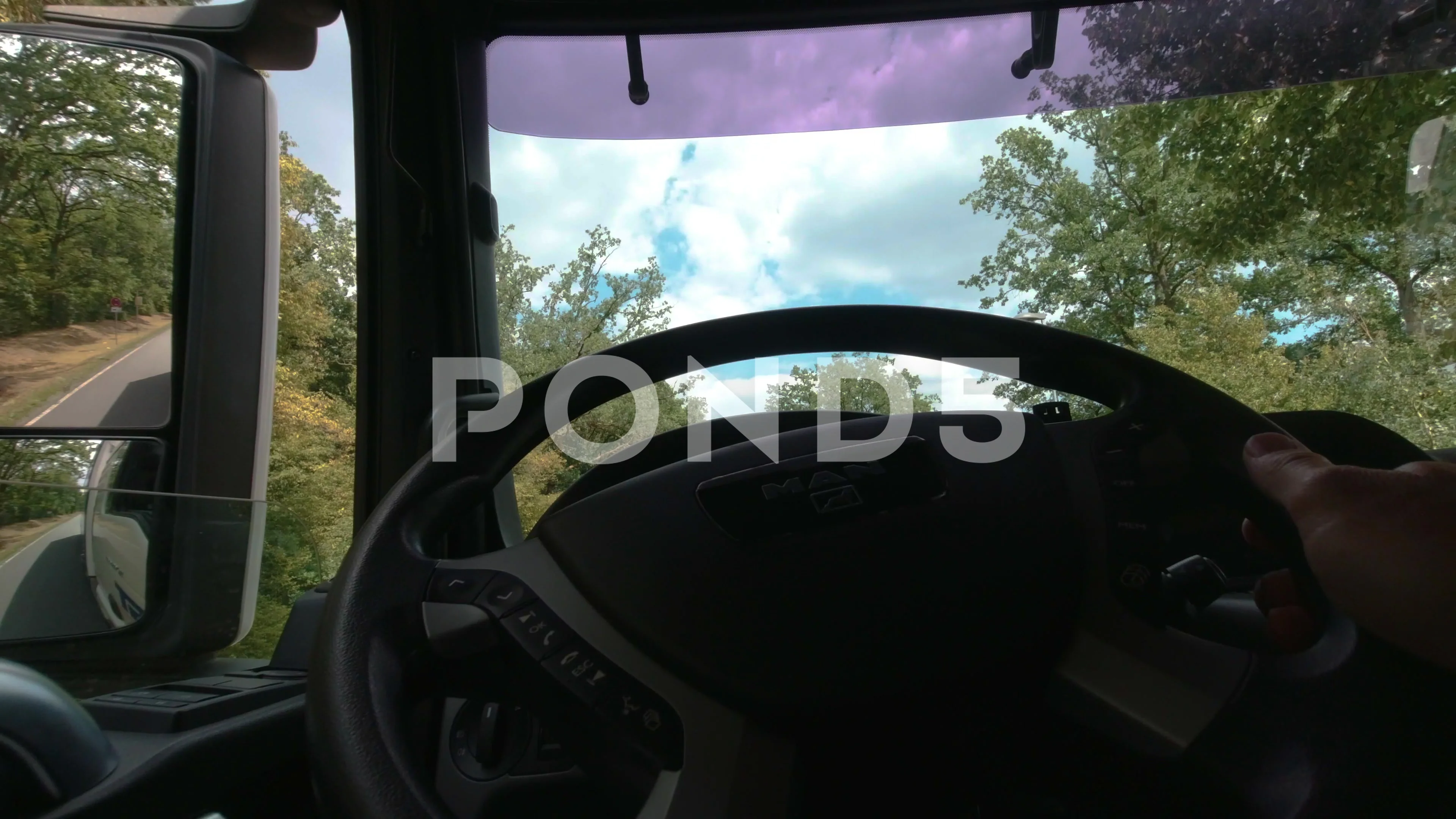 POV Truck Driver behind steering wheel | Stock Video | Pond5