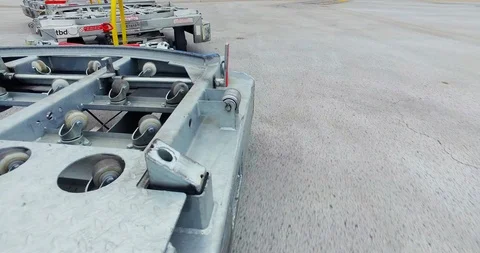 POV Tug baggage dollies pulling up next to plane Stock Footage 114057147
