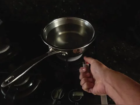 POV turning on the stove Stock Footage 319963729