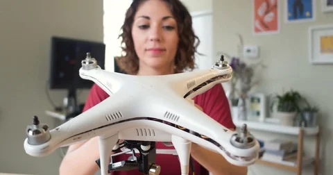 POV Two hands assembling the top of a quadcopter drone with young tech Stock Footage 84292442