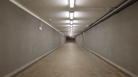 POV Underground empty corridor walking alone night lights Stock Footage