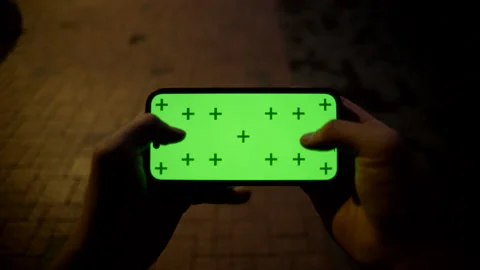 POV of Using Smartphone with Green Screen Stock Footage 319703623