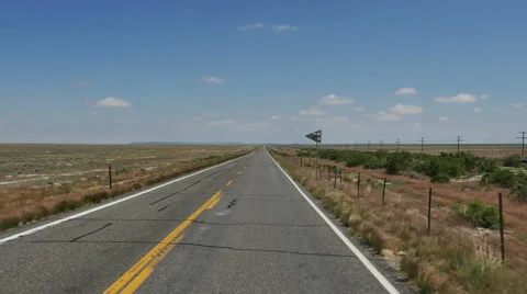 POV-vast empty plain railroad running parallel Stock Footage 64658154