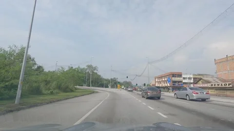 POV of a vehicle passing through a traffic light intersection Stock Footage 314060376