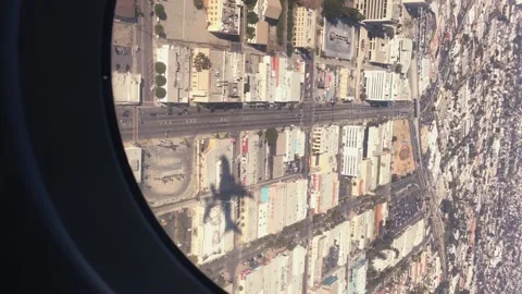 POV vertical video Airplane Window View landing in Los Angelos Travel Stories Stock Footage 166962907