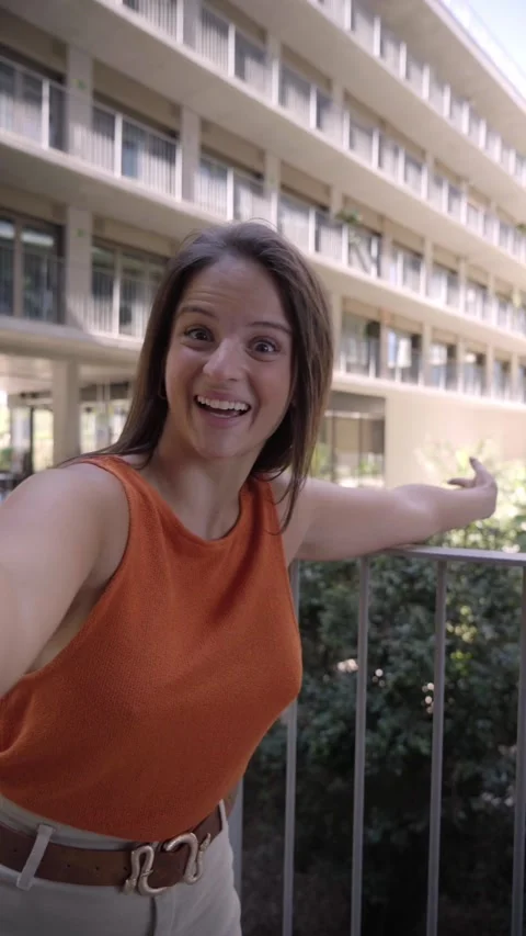 POV vertical young Caucasian smiling and cheerful woman talking to camera on Stock Footage 239106176