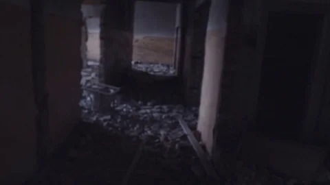 POV view camera moves through dark corridor in abandoned building Stock Footage 80311148
