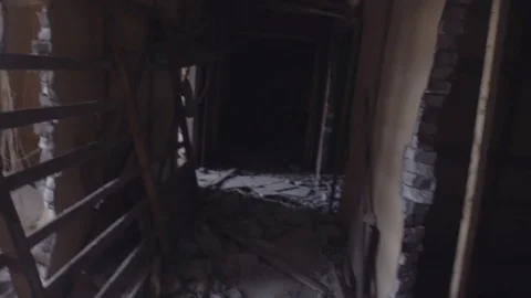 POV view camera moves through dark corridor in abandoned building Stock Footage 80311315